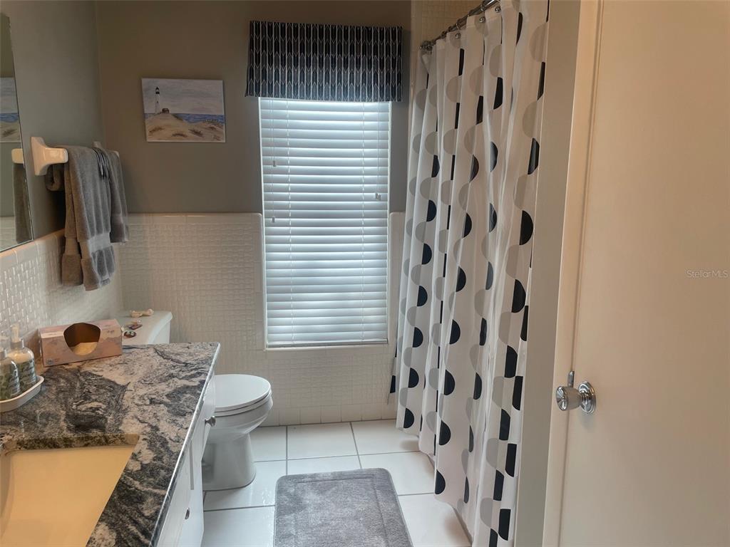 2019 High Ridge Drive Clearwater, FL 33763 - Photo 11 of 30 a bathroom with a sink toilet and shower