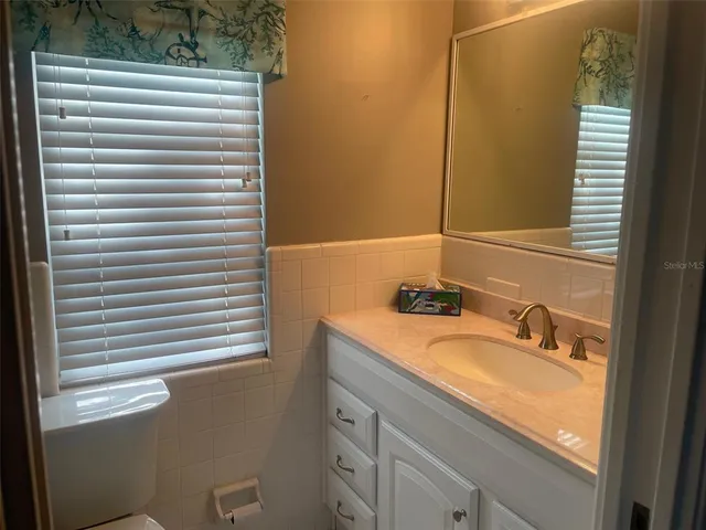 a bathroom with a toilet and a sink