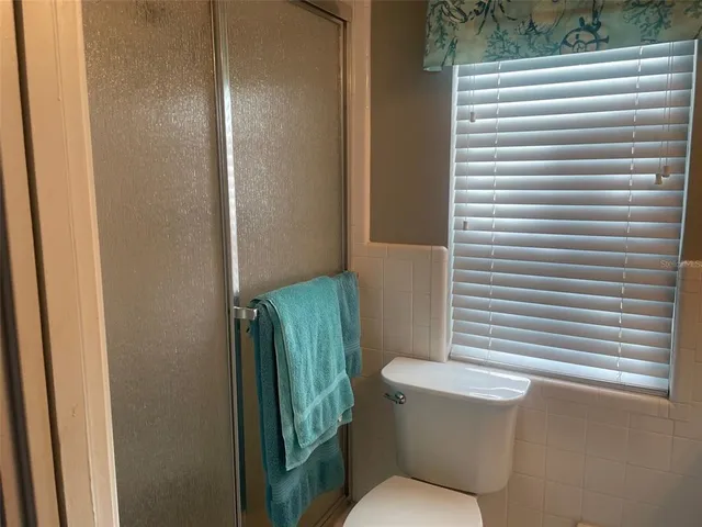 an empty room with a empty space and windows