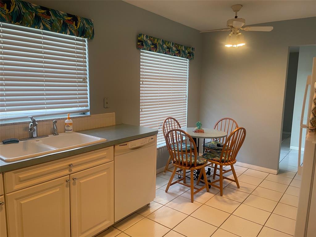 2019 High Ridge Drive Clearwater, FL 33763 - Photo 6 of 30 a view of a kitchen area with furniture and chandelier