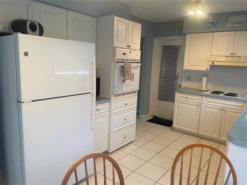 2019 High Ridge Drive Clearwater, FL 33763 - Photo 8 of 30 a kitchen with cabinets stainless steel appliances and a refrigerator