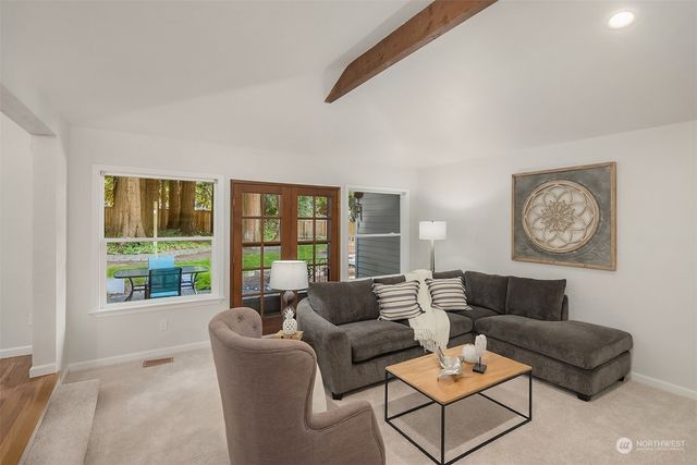 a view of a patio with table and chairs and wooden floor