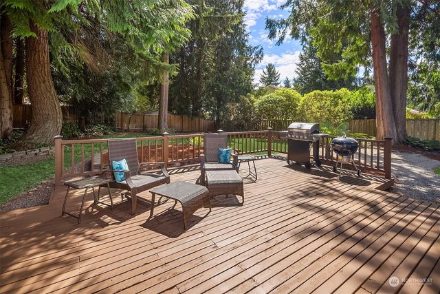 a view of backyard with outdoor seating and plants