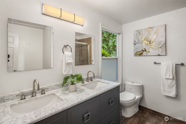 a bedroom with a bed and a chair