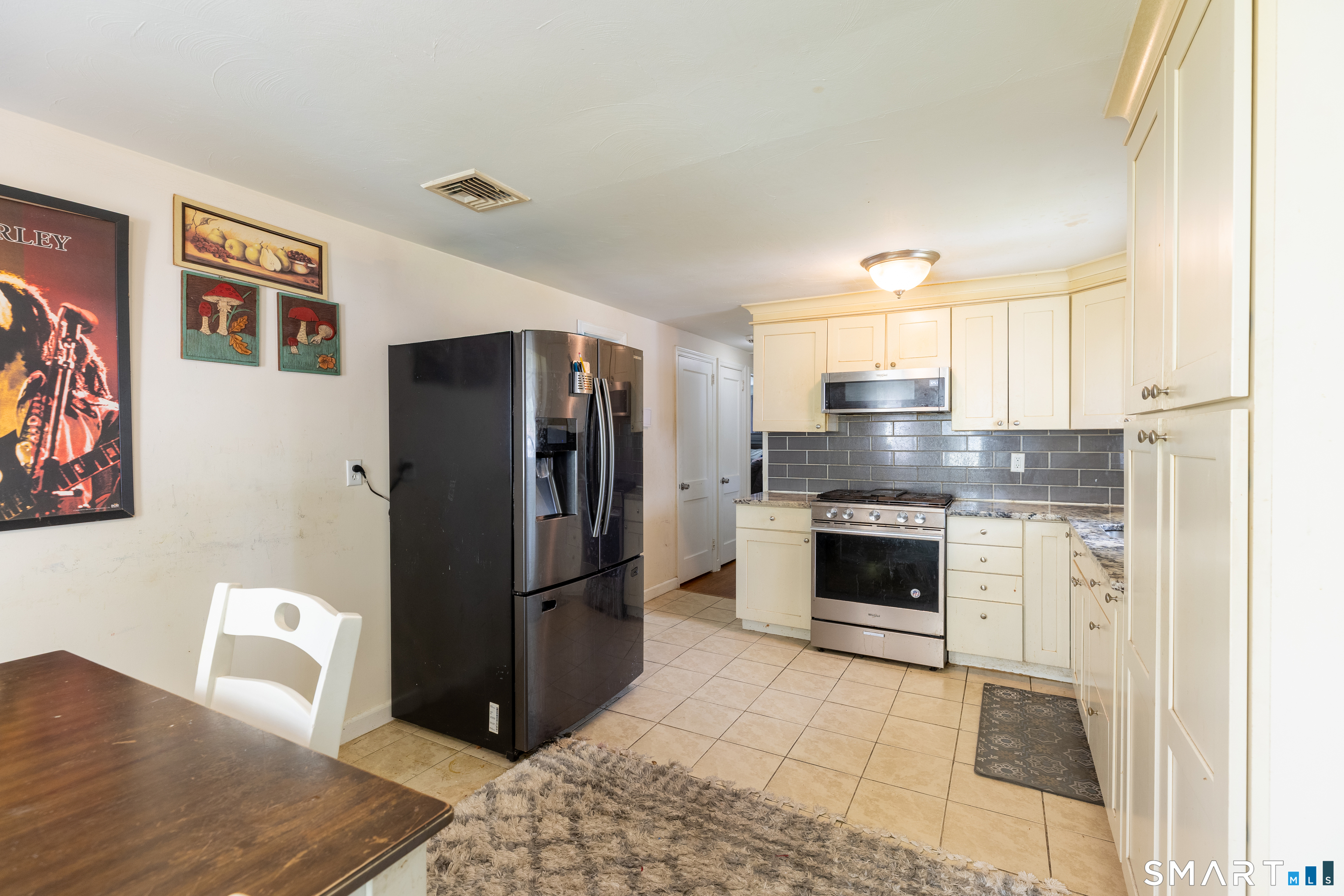 170 Amherst Street Hartford, CT 06106 - Photo 13 of 24 a kitchen with stainless steel appliances granite countertop a refrigerator stove and sink