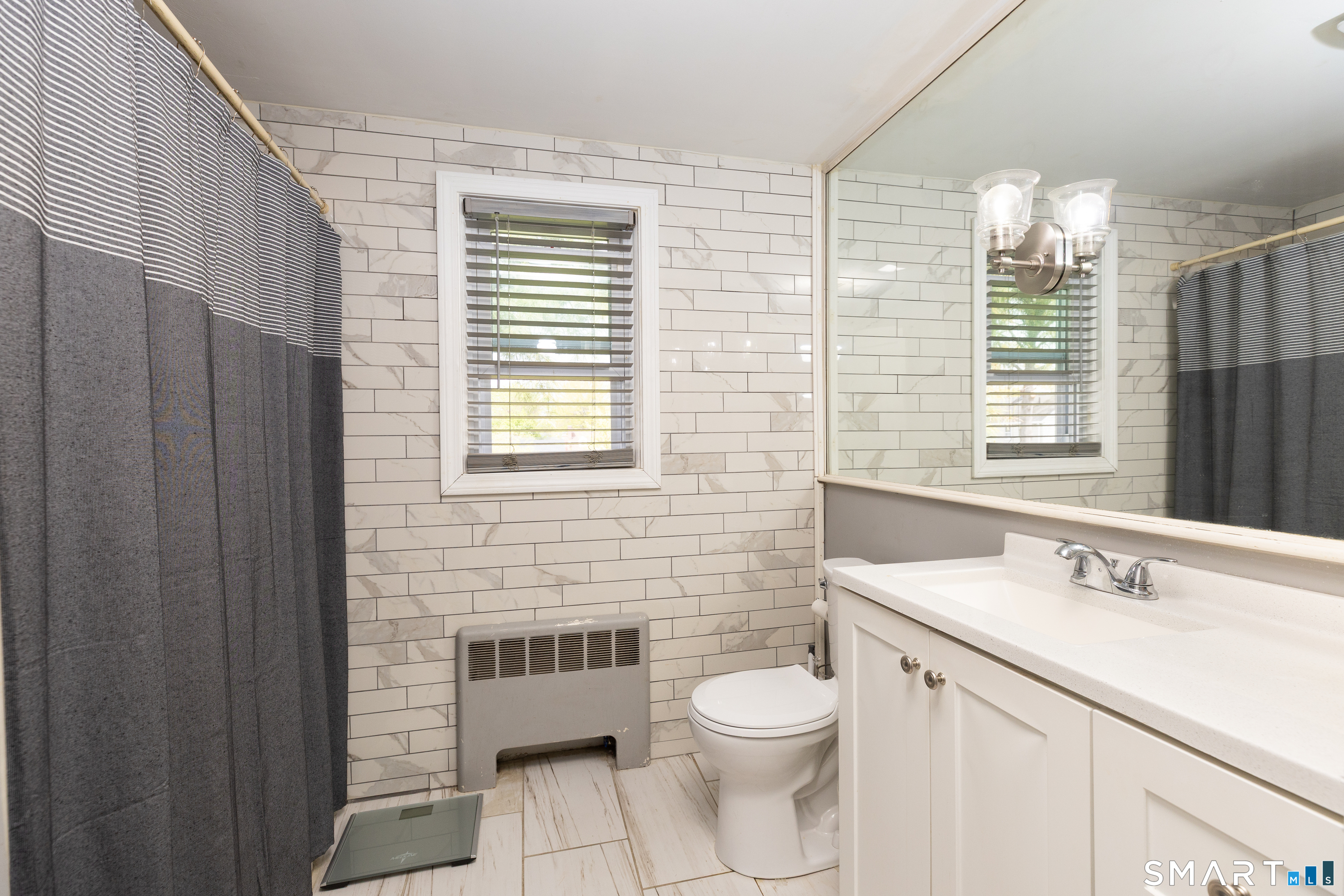 170 Amherst Street Hartford, CT 06106 - Photo 16 of 24 a bathroom with a sink a toilet and a window