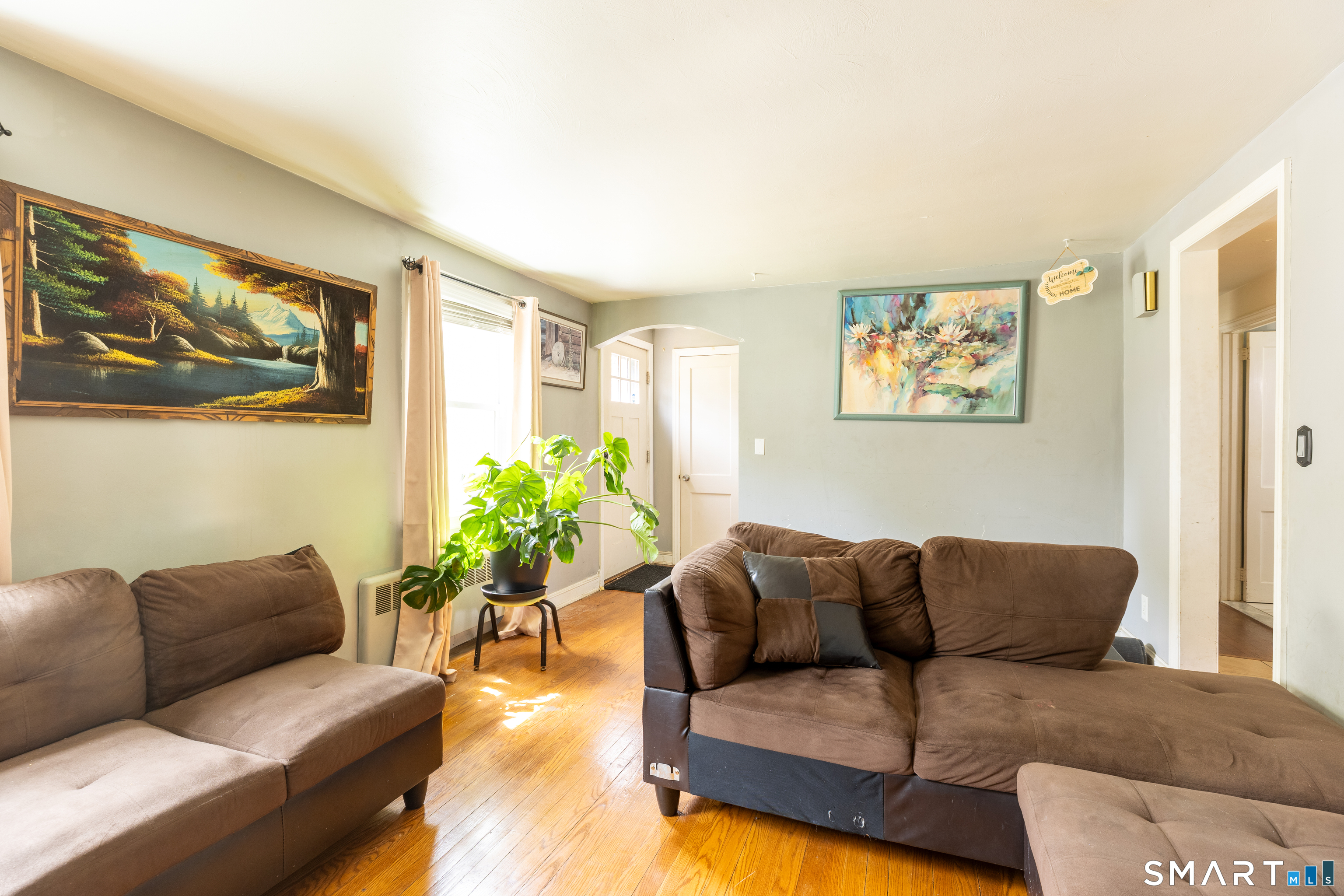 170 Amherst Street Hartford, CT 06106 - Photo 8 of 24 a living room with furniture and paintings on the wall