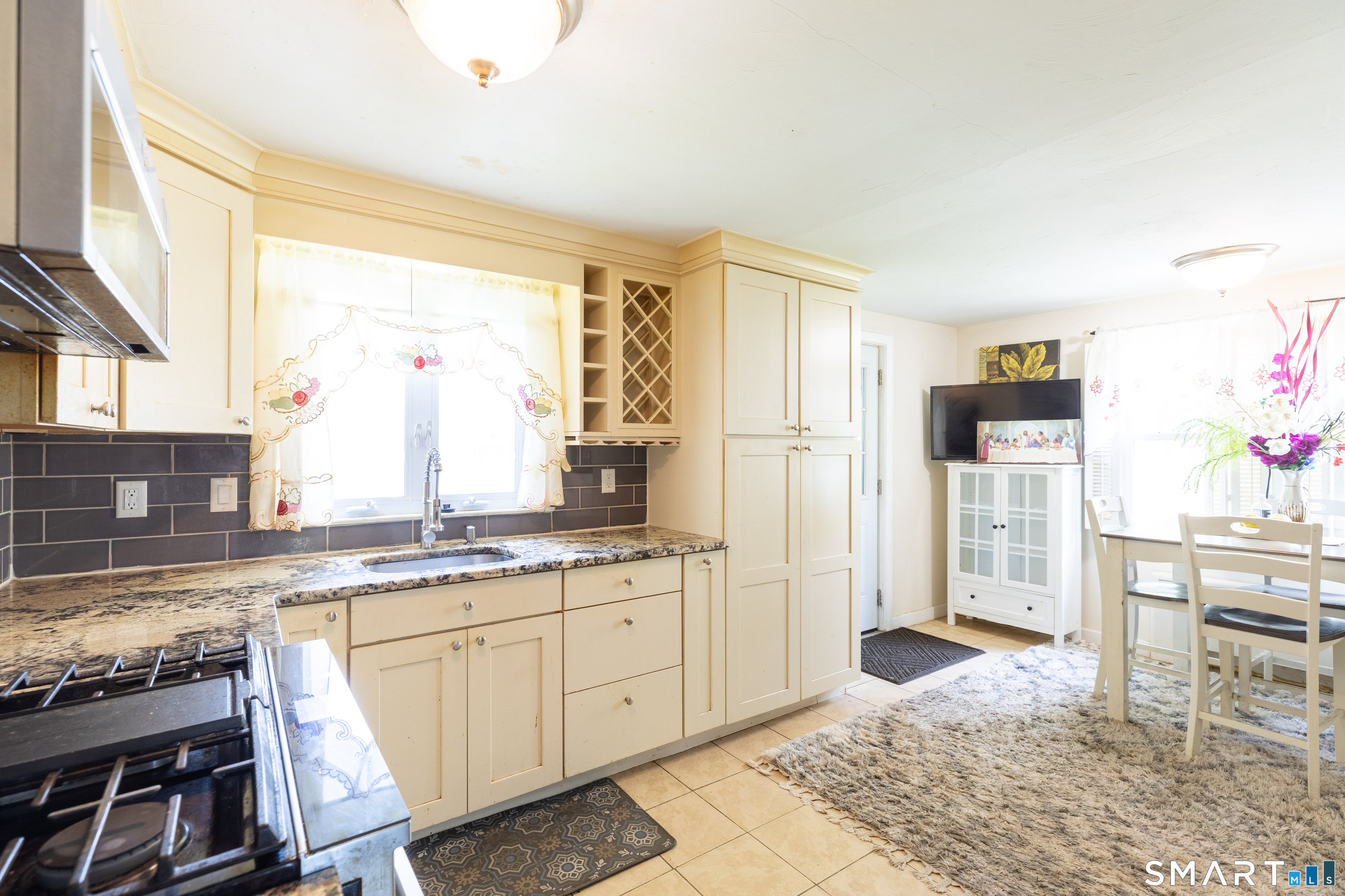 170 Amherst Street Hartford, CT 06106 - Photo 10 of 24 a kitchen with a sink stove and refrigerator