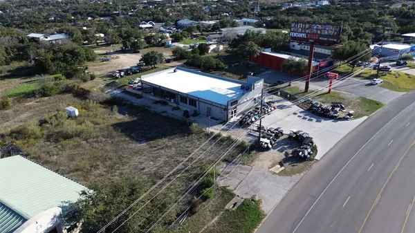 an aerial view of a house with a yard