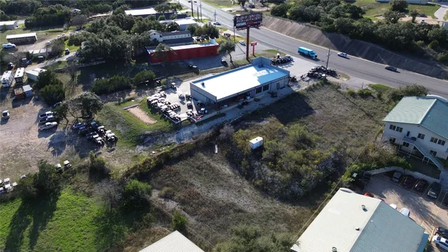 an aerial view of a house with a lake view