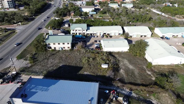 an aerial view of a houses with outdoor space