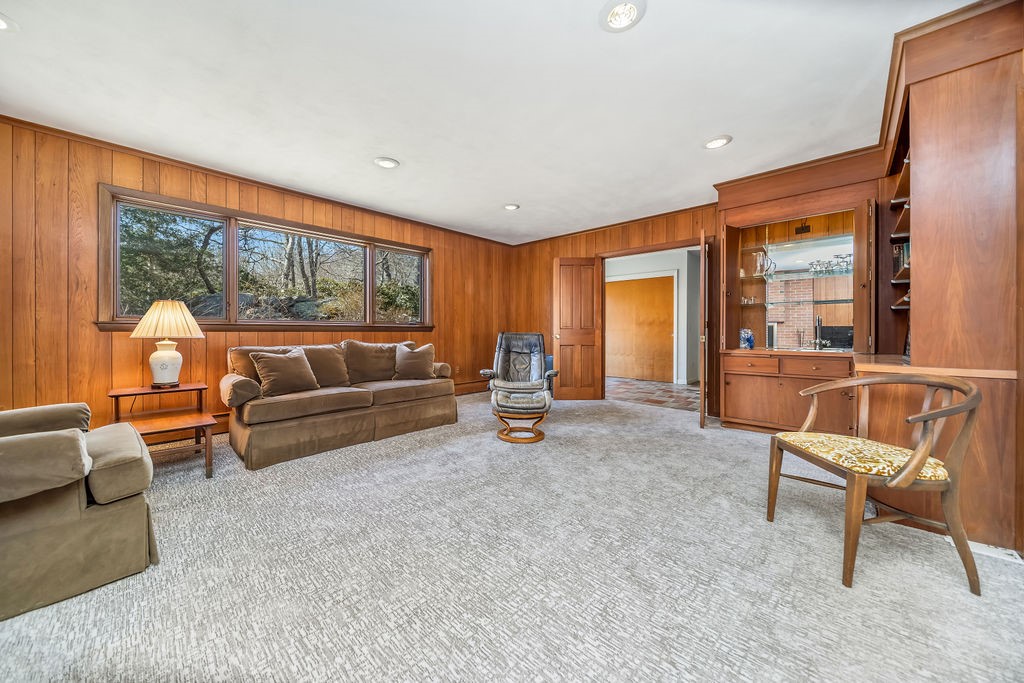 39 Brookside Drive Charlestown, RI 02813 - Photo 6 of 33 includes built-ins, woodburning fireplace and sliders to 3 season room