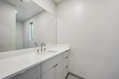 a bathroom with a glass shower door