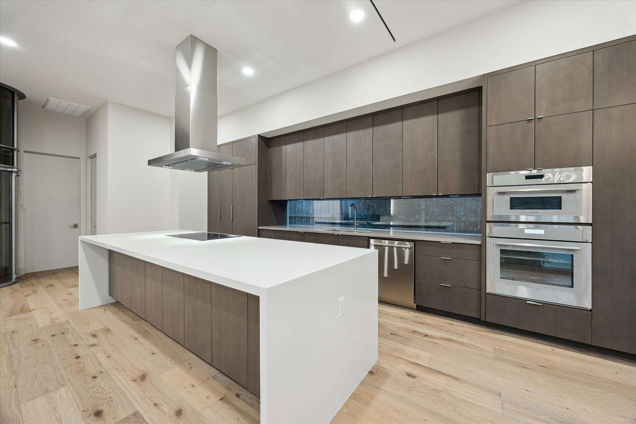 2129 Quenby Street Houston, TX 77005 - Photo 8 of 37 a kitchen with a sink cabinets and stainless steel appliances