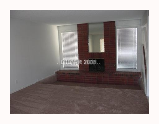 4015 Ridgewood Avenue Las Vegas, NV 89120 - Photo 3 of 5 Property Photo. Spacious Family Room with cozy fireplace!