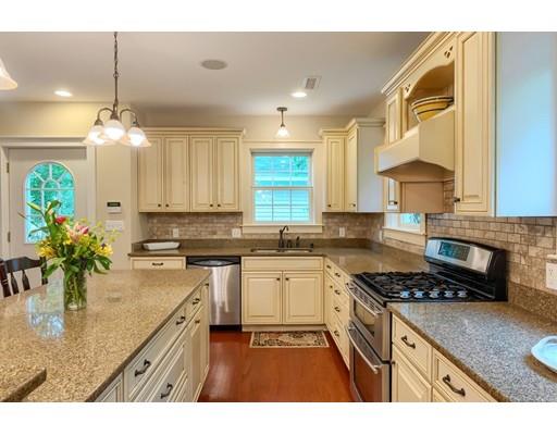 31 Boston Road Chelmsford, MA 01824 - Photo 14 of 42 a kitchen with stainless steel appliances granite countertop a sink stove and refrigerator