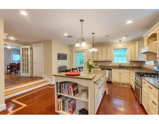 31 Boston Road Chelmsford, MA 01824 - Photo 17 of 42 a open kitchen with stainless steel appliances granite countertop a stove and cabinets