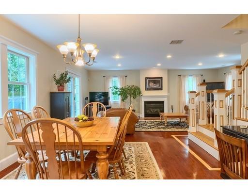 31 Boston Road Chelmsford, MA 01824 - Photo 19 of 42 a view of a dining room with furniture a chandelier and wooden floor