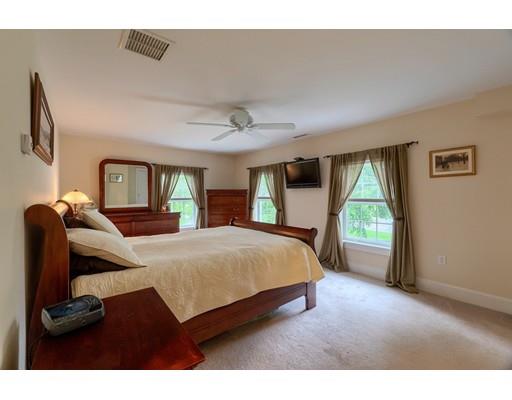31 Boston Road Chelmsford, MA 01824 - Photo 26 of 42 a bedroom with a large bed and a large window