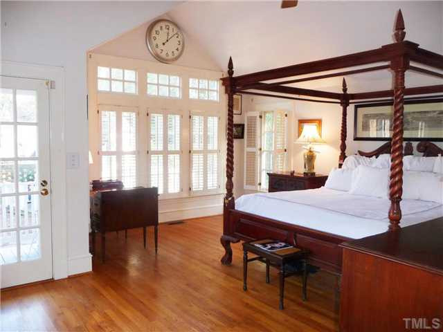 2324 Byrd Street Raleigh, NC 27608 - Photo 11 of 15 The master bedroom features a vaulted ceiling, exposed beams, hardwood floors and its own entry to the courtyard. Master Suite