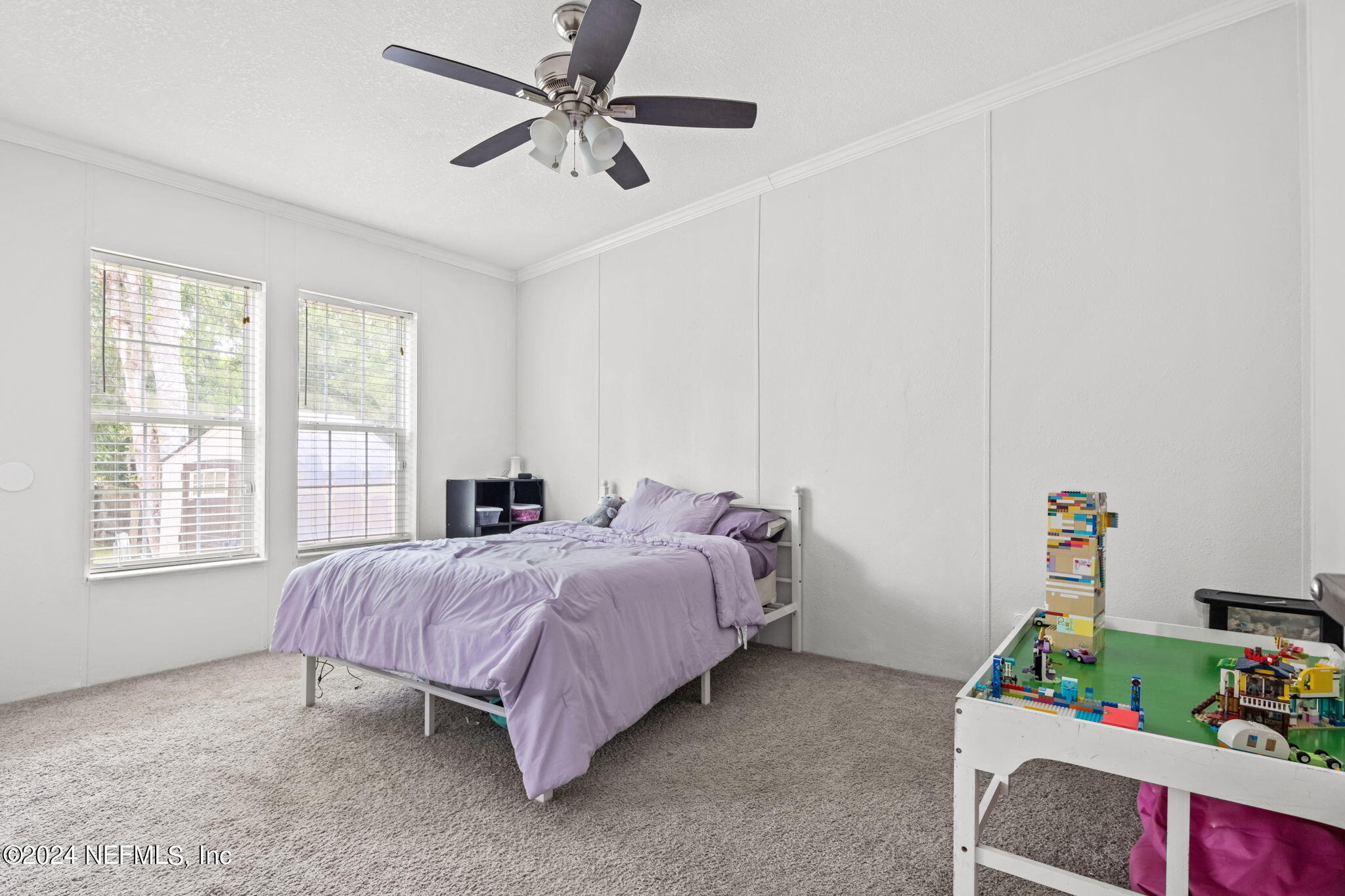 54037 Parks Road Callahan, FL 32011 - Photo 19 of 26 a bed room with a bed and a window