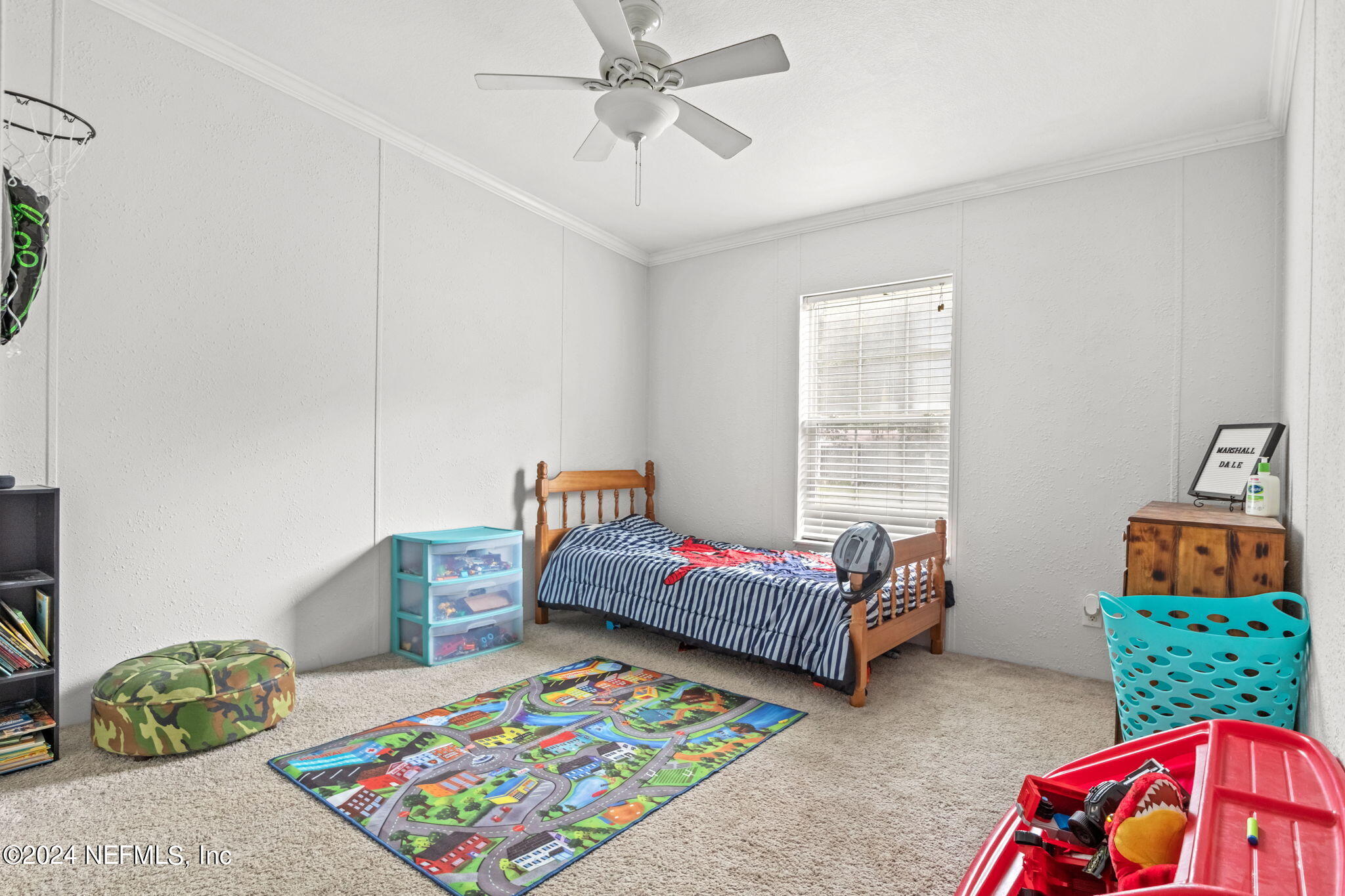 54037 Parks Road Callahan, FL 32011 - Photo 20 of 26 a living room with baby crib furniture and a window