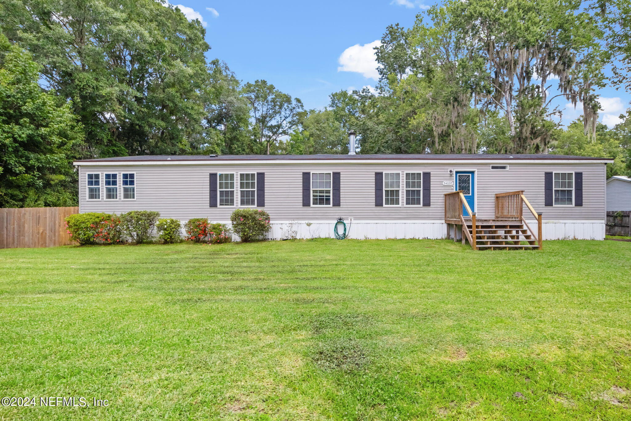 54037 Parks Road Callahan, FL 32011 - Photo 2 of 26 a view of a house with backyard and chairs