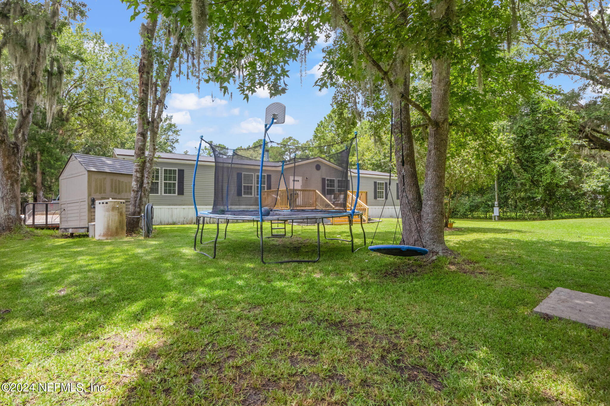 54037 Parks Road Callahan, FL 32011 - Photo 24 of 26 a view of a house with a backyard