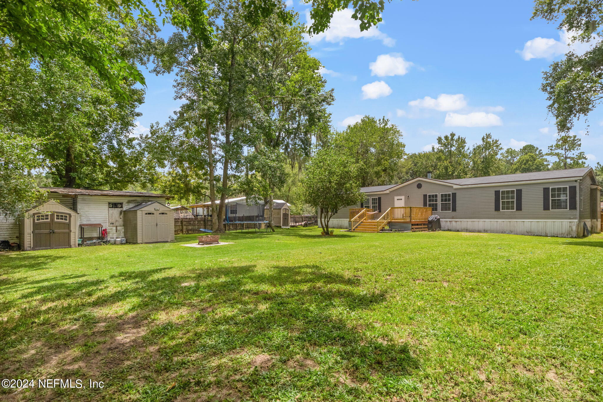 54037 Parks Road Callahan, FL 32011 - Photo 25 of 26 a front view of house with yard and green space