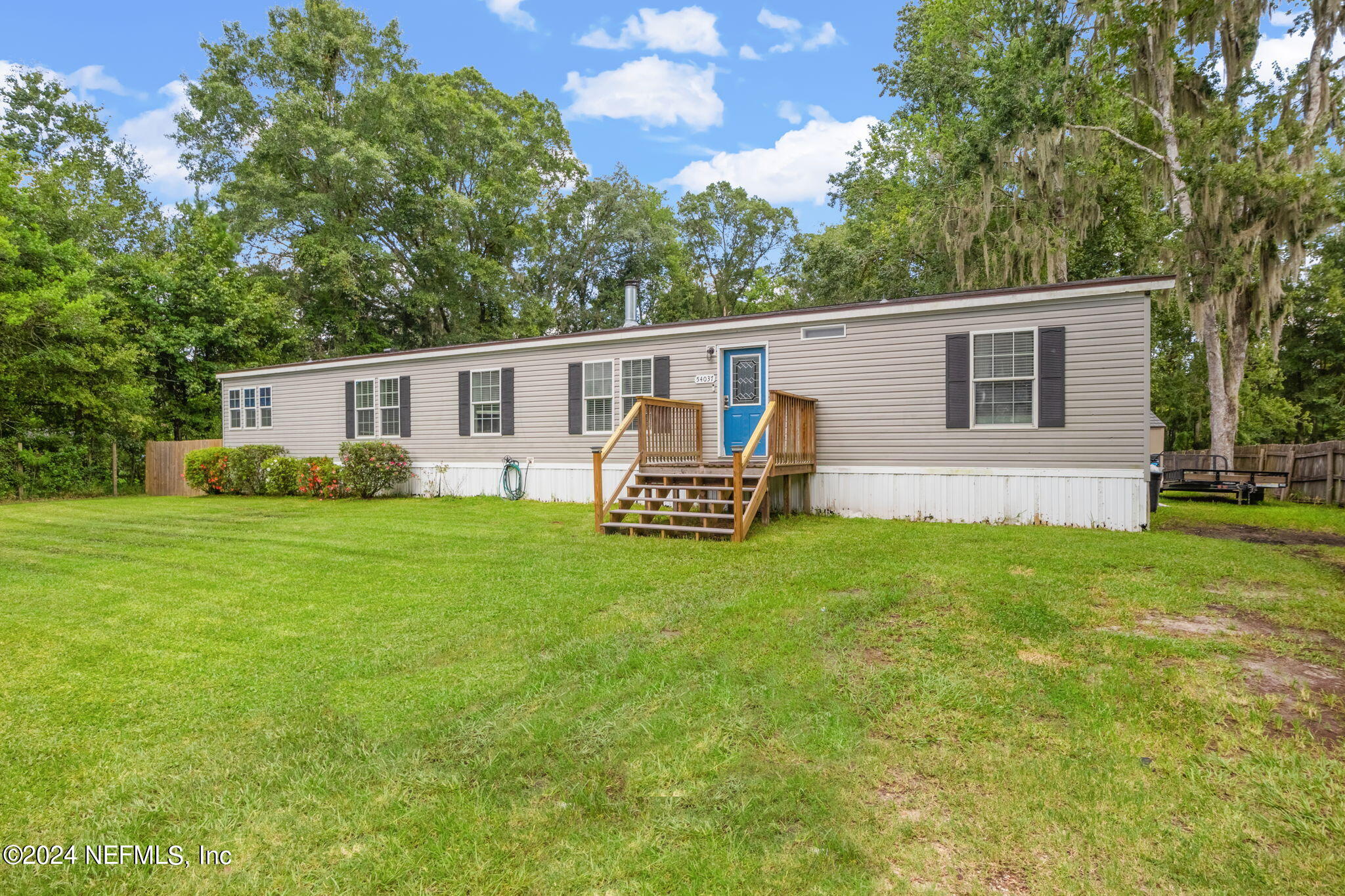54037 Parks Road Callahan, FL 32011 - Photo 3 of 26 a house view with a garden space