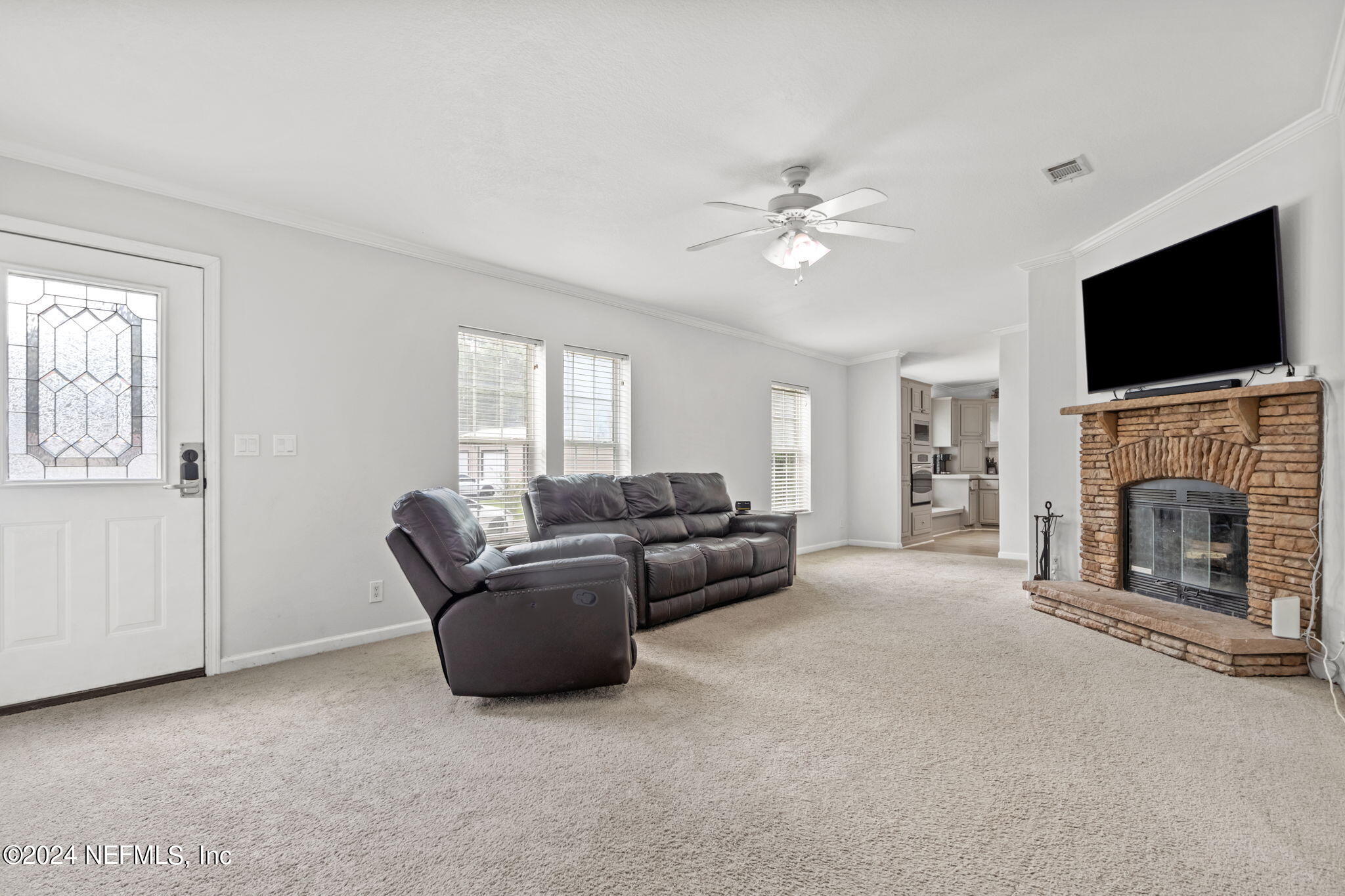 54037 Parks Road Callahan, FL 32011 - Photo 4 of 26 a living room with furniture and a flat screen tv