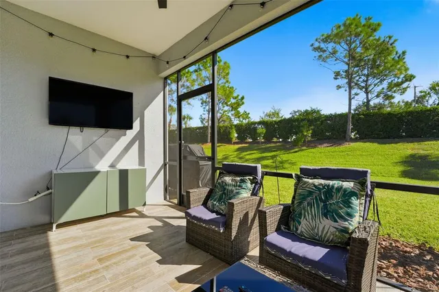 an aerial view of residential houses with outdoor space and lake view