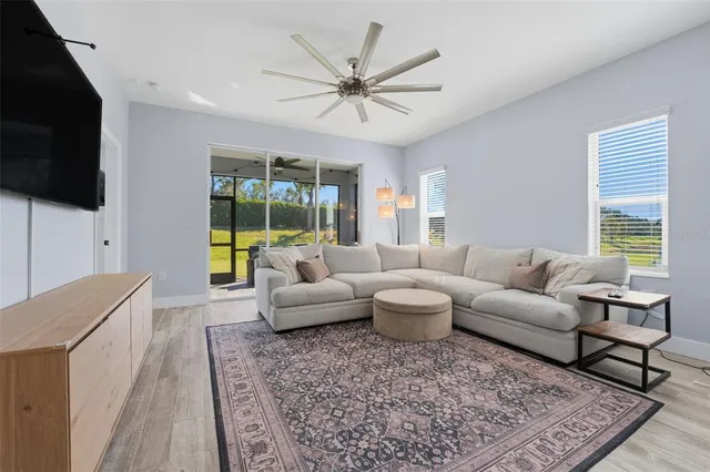 a kitchen with kitchen island granite countertop wooden floors and white appliances