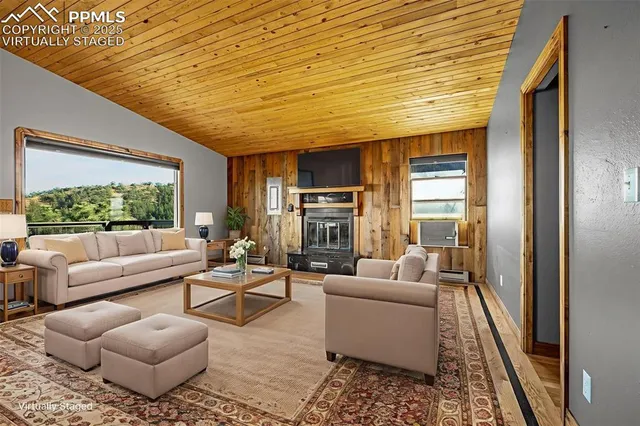 a living room with lots of furniture and a table