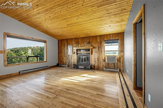 a swimming pool with chairs and wooden floor
