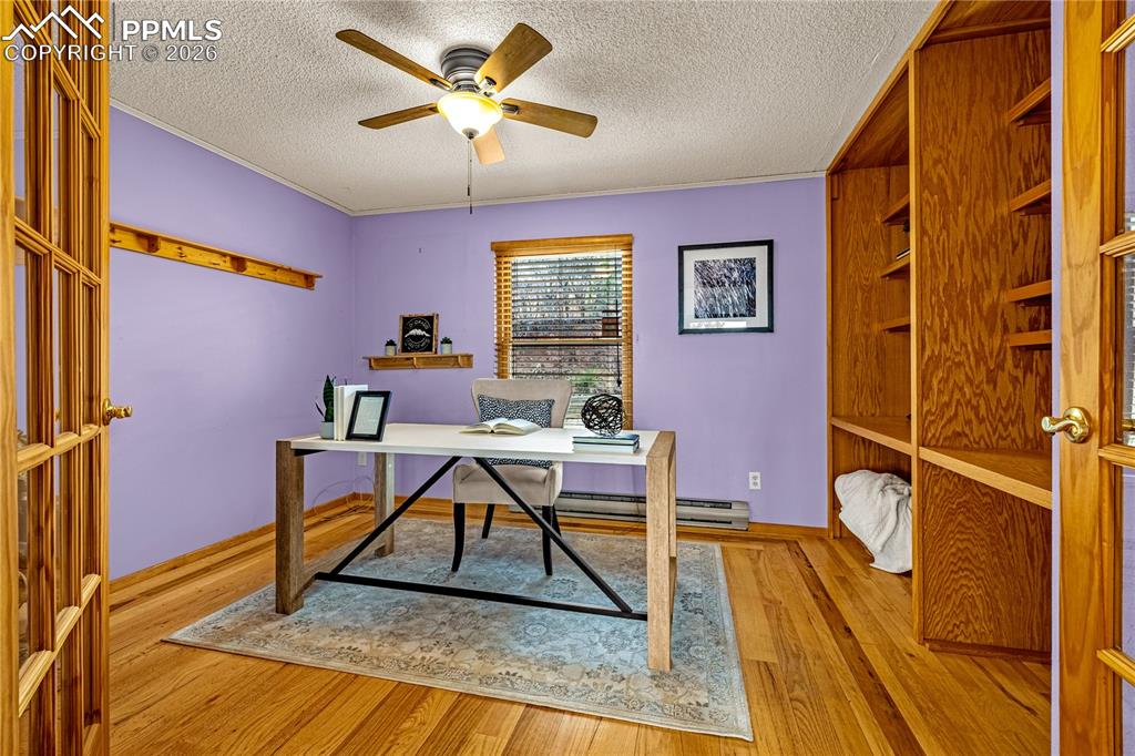 845 Crystal Park Road Manitou Springs, CO 80829 - Photo 18 of 50 a work room with furniture and a rug