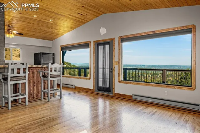 a kitchen with stainless steel appliances granite countertop a sink and wooden cabinets