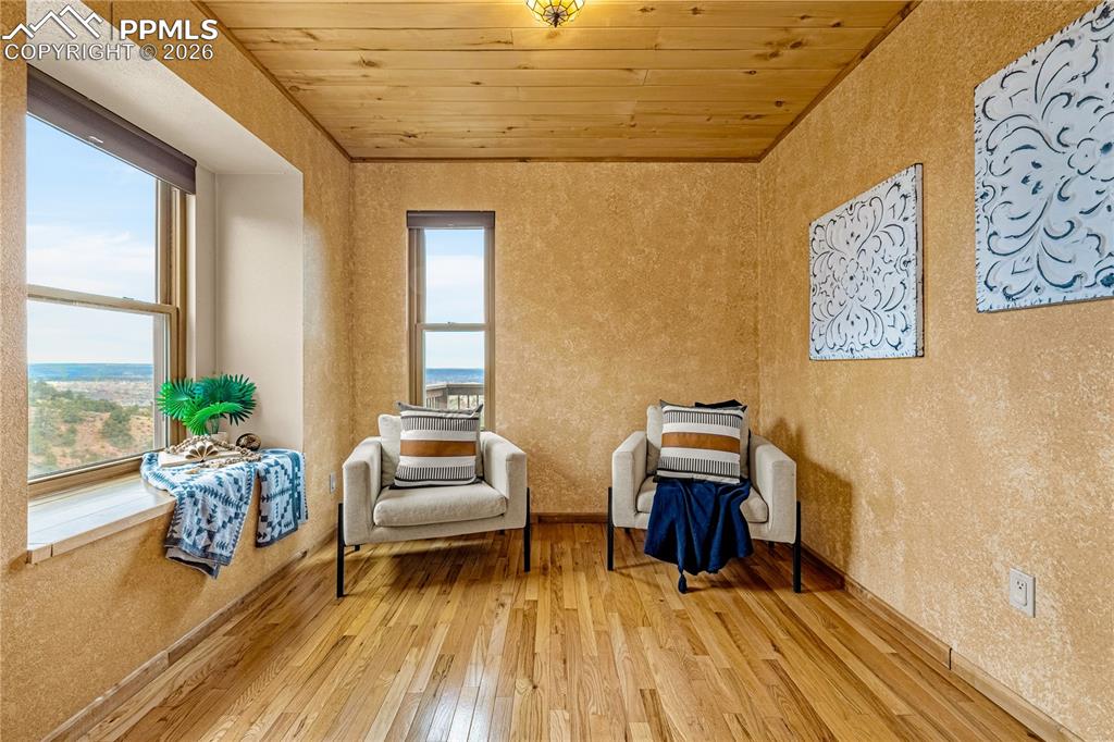 845 Crystal Park Road Manitou Springs, CO 80829 - Photo 22 of 50 a living room with furniture and wooden floor