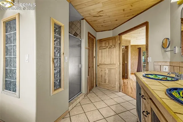 a bathroom with a tub and a window