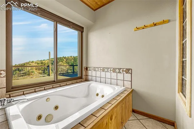 a view of a bathroom sink and a window