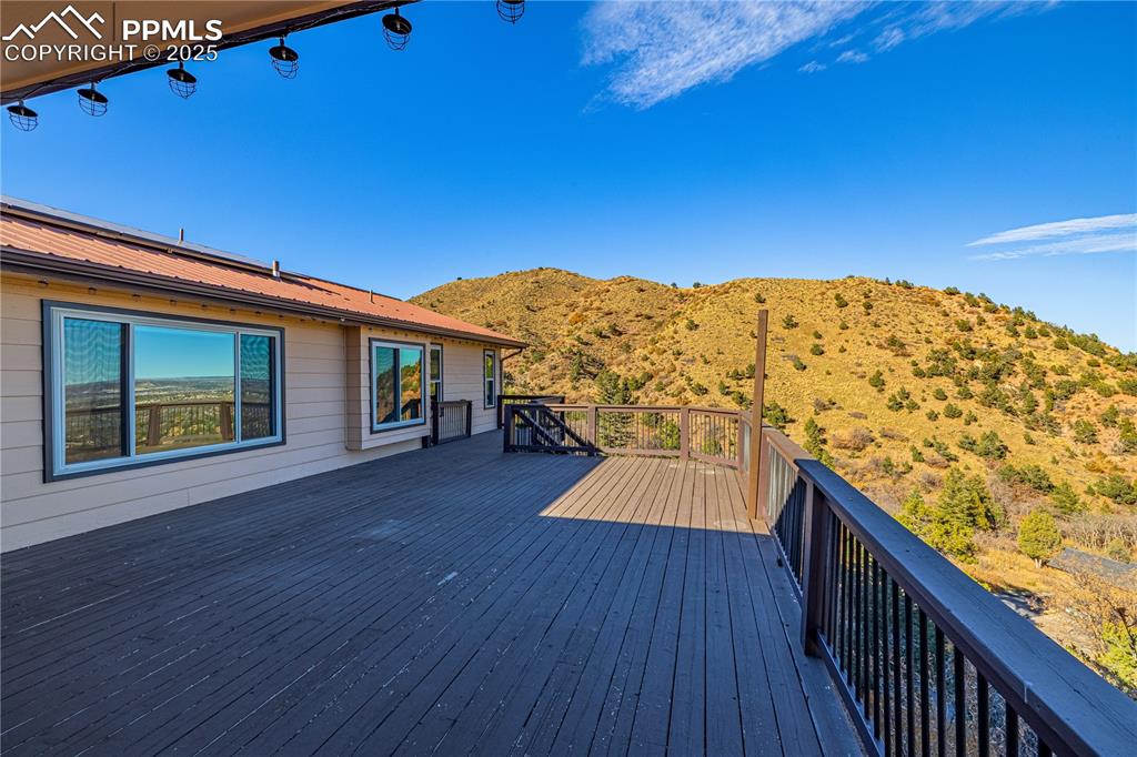 845 Crystal Park Road Manitou Springs, CO 80829 - Photo 40 of 50 a view of balcony with wooden floor and fence