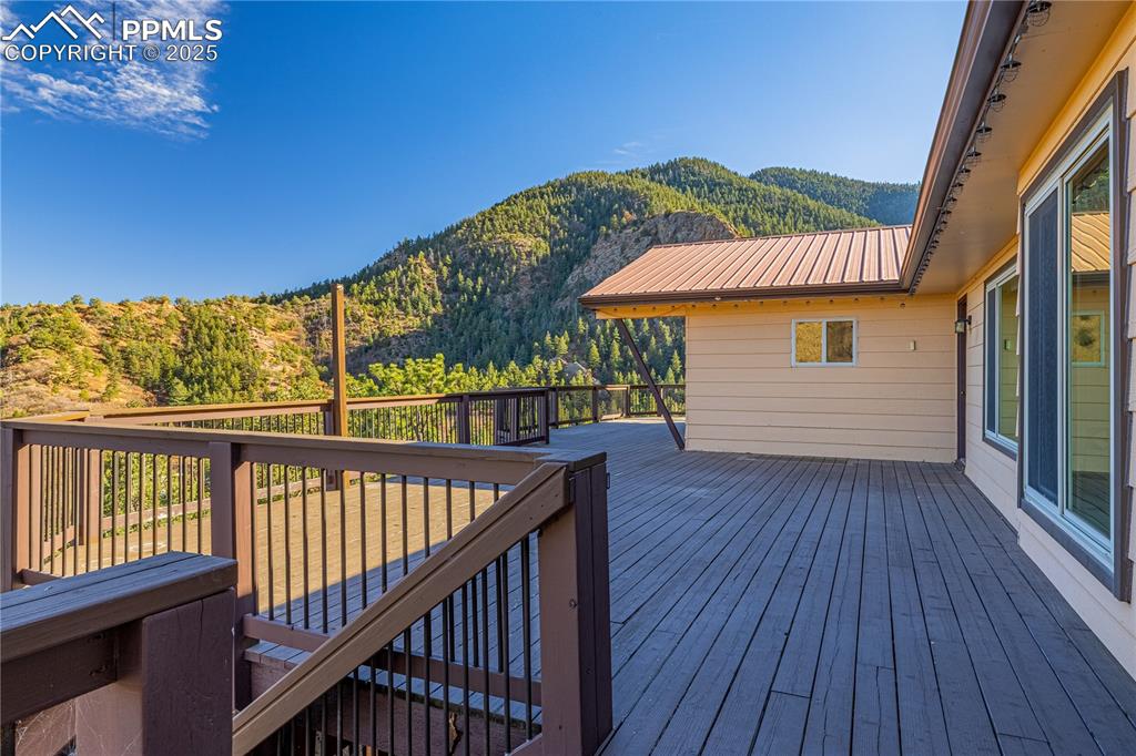 845 Crystal Park Road Manitou Springs, CO 80829 - Photo 43 of 50 a view of a balcony with wooden floor