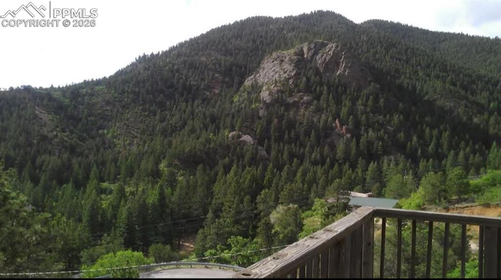 845 Crystal Park Road Manitou Springs, CO 80829 - Photo 48 of 50 a view of a forest from a balcony