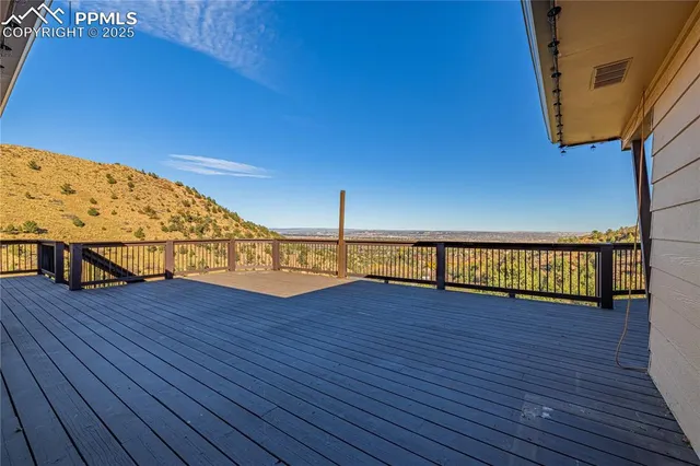 a view of a balcony with wooden floor