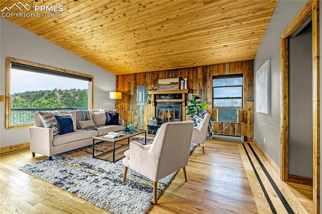 845 Crystal Park Road Manitou Springs, CO 80829 - Photo 5 of 50 a living room with furniture and a wooden floor