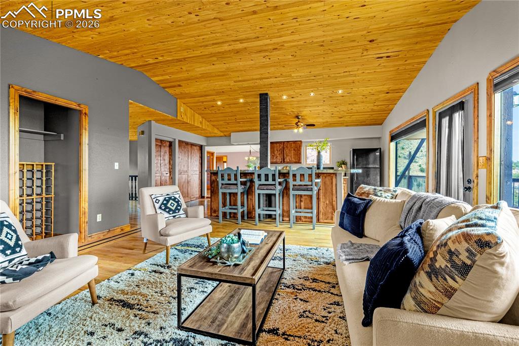 845 Crystal Park Road Manitou Springs, CO 80829 - Photo 7 of 50 a living room with furniture and wooden floor