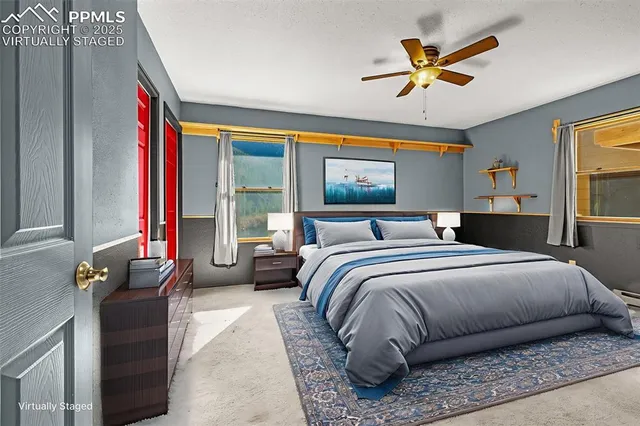 a bedroom with a bed and dresser with mirror