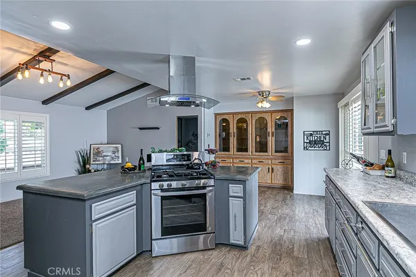 a kitchen with stainless steel appliances granite countertop a stove and a sink