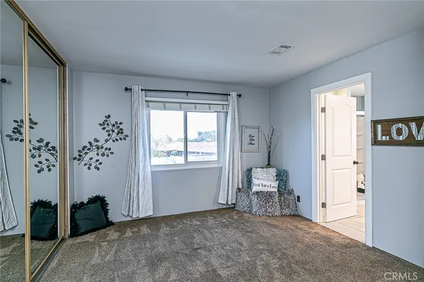 a view of room with window and furniture