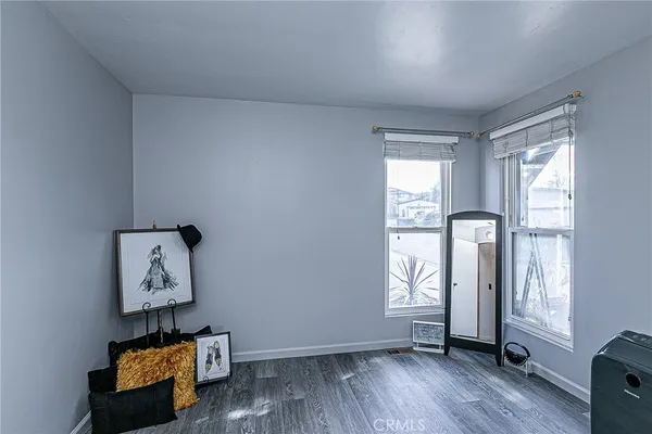 a room with furniture and wooden floor